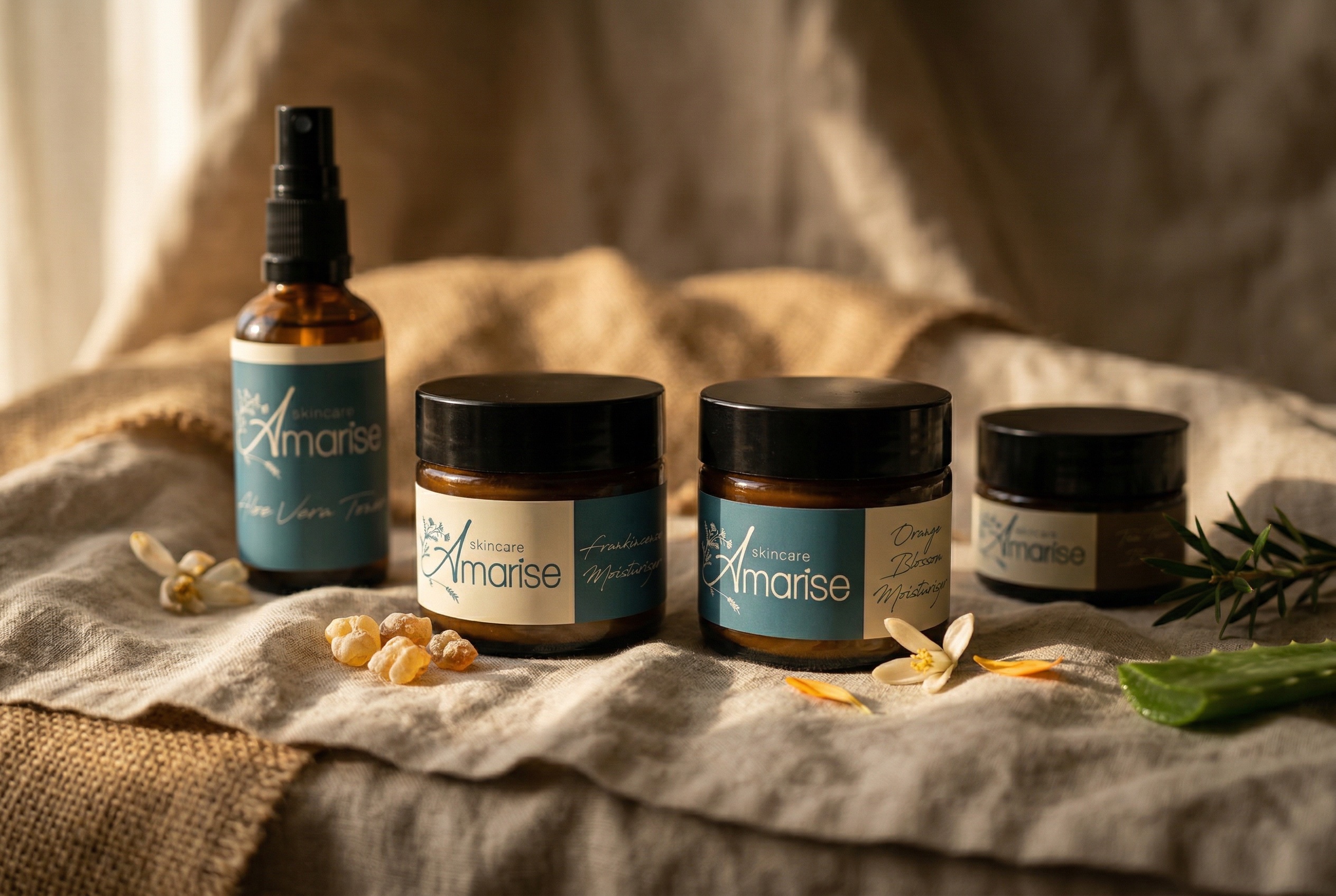 Amarise skincare products on natural linen